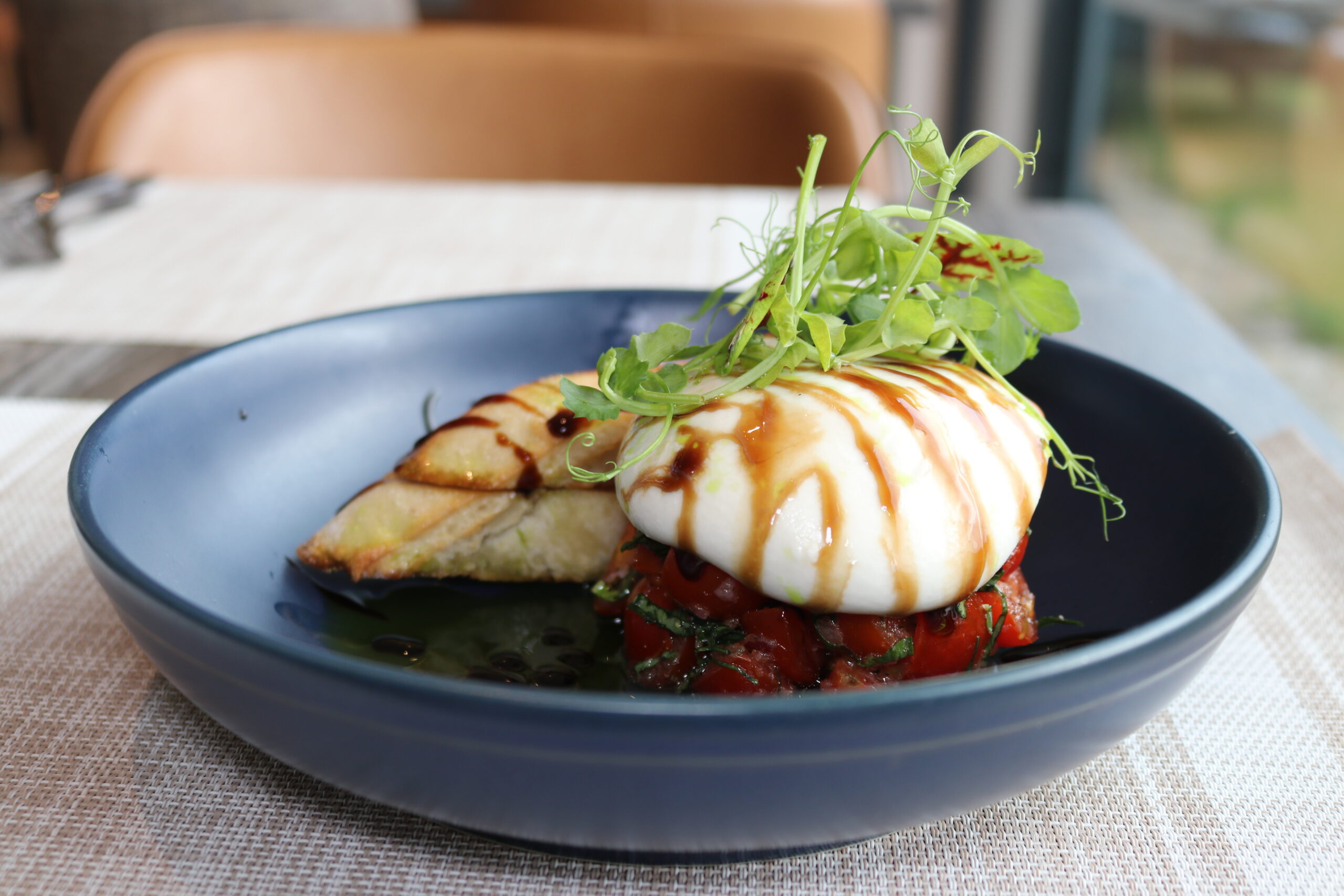 Fresh seafood dish with burrata and greens in a cosy Balmacara hotel restaurant.