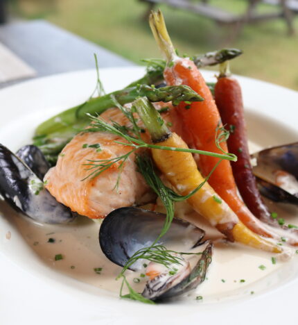 Gourmet seafood and vegetable dish at Balmacara hotel restaurant.