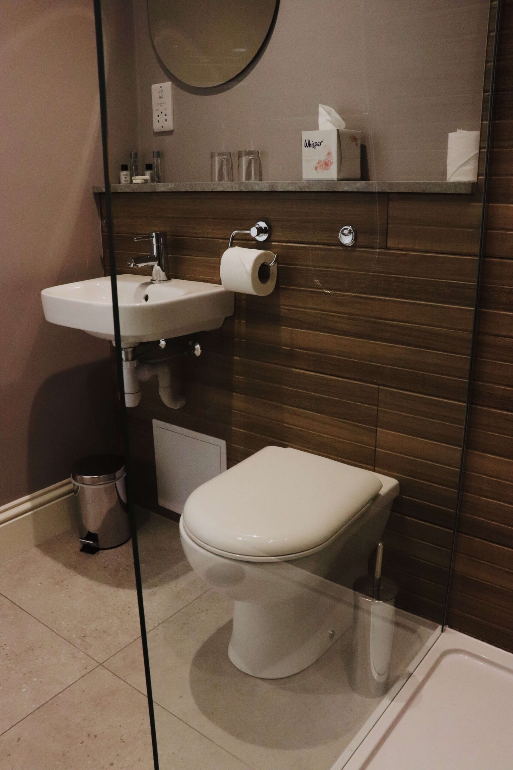 Modern bathroom in Balmacara hotel, featuring sleek amenities and elegant design details.